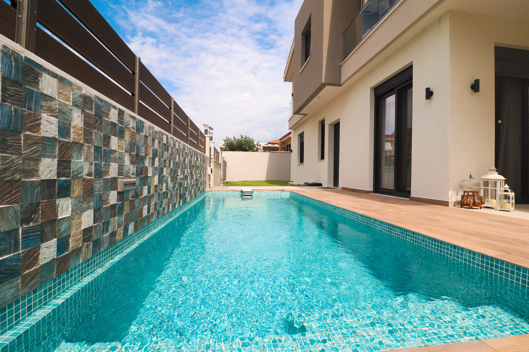 Private pool and villa exterior, daytime